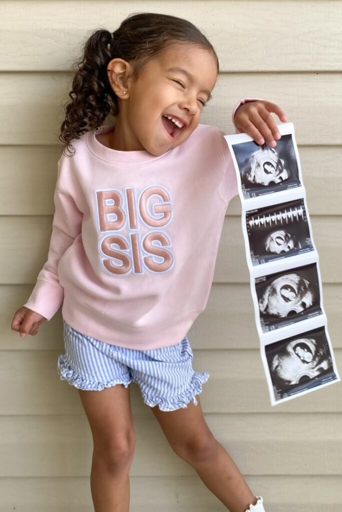 Celebrating a toddler’s new role as an older sibling.